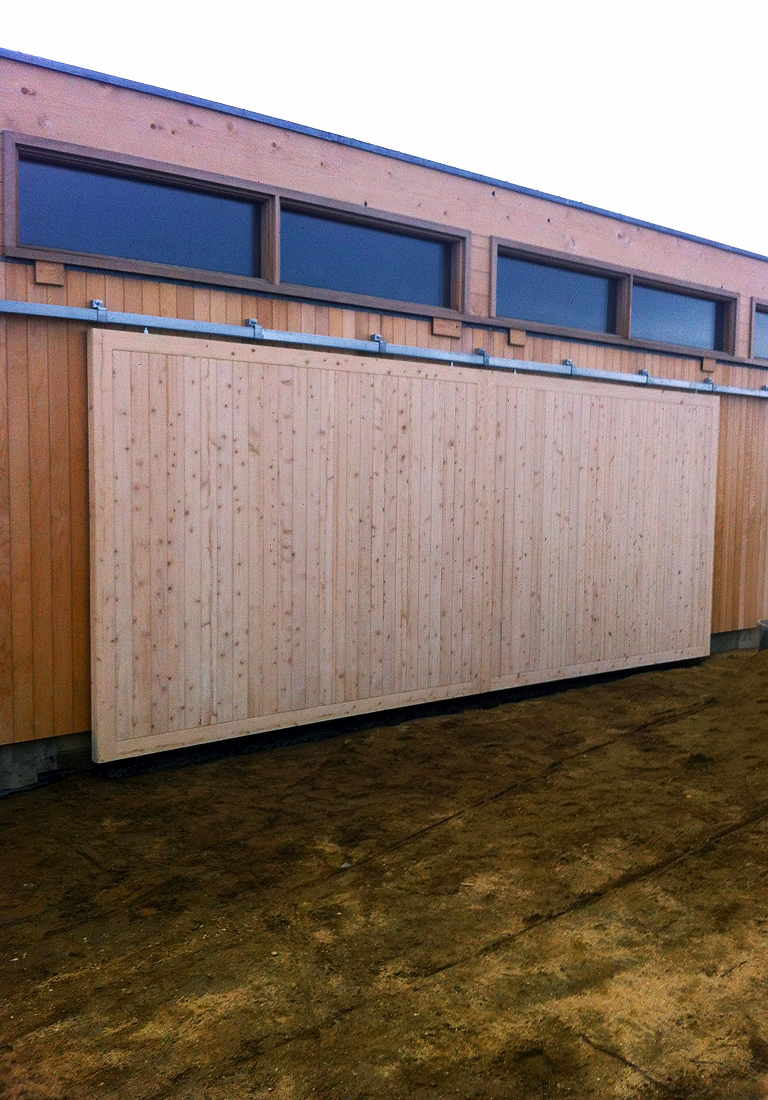 custom Hamptons style garage with 18 ft barn sliders